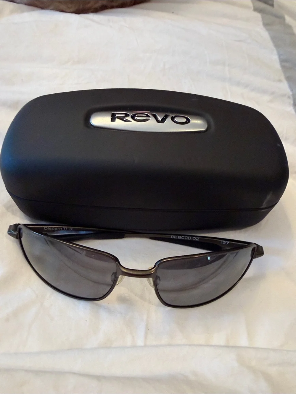 Revo Sunglasses in Black Frames with Gray Lenses and Branded Case. Discontinued